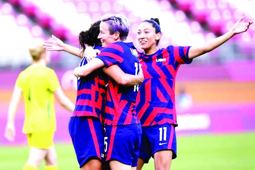 Carli Lloyd (left) of the United States celebrates scoring their fourth goal with Megan Rapinoe (center) of the United States and Christen Press of the United States in the women’s soccer against Australia at Ibaraki Kashima Stadium, Ibaraki in Japan on