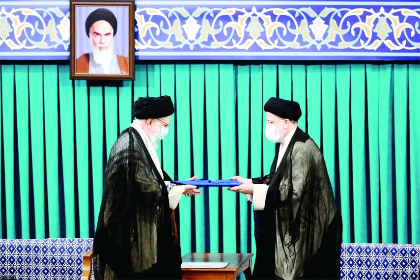 Supreme Leader Ayatollah Ali Khamenei, left, gives his official seal of approval to Ebrahim Raisi in an endorsement ceremony in Tehran. Iran, recently.