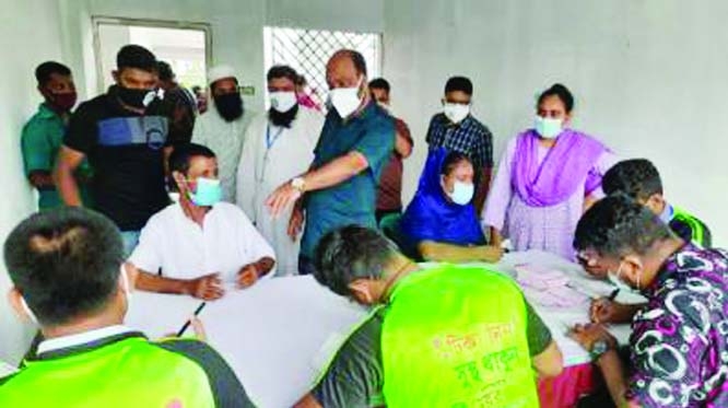 Photo shows the mass vaccination program at ward-level centre under Mymensing City Corporation with active monitoring of its mayor Md. Ekramul Haque Titu on Saturday.