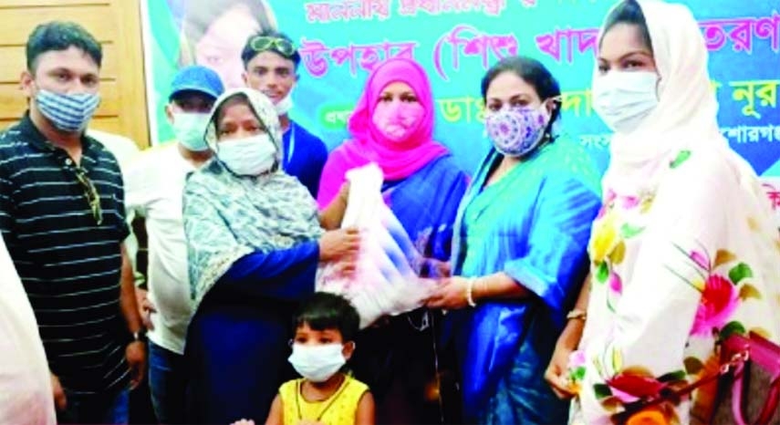 Zakia Noon Lipi, MP on Saturday distributes baby food provided by the Prime Minister Sheikh Hasina as aid among the 200 jobless and destitute people living in Hossainpur Upazila of Kishoreganj in a formal ceremony on Upazila Parishad premises with UNO Rab