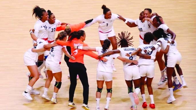 Team members of France celebrate after winning gold medal in Tokyo 2020 Olympics women's handball at Yoyogi National Stadium Tokyo, Japan on Sunday.