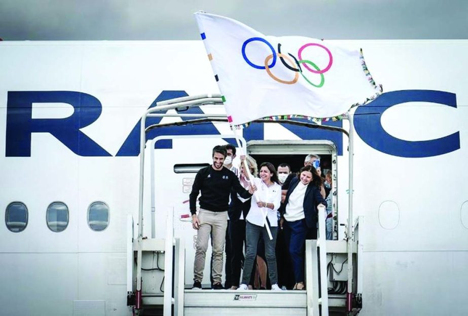 President of French National Olympic Committee Brigitte Henriques (2ndleft, partially hidden) and French Delegate Minister of Sports Roxana Maracineanu (right) watch as President of the Paris Organising Committee of the 2024 Olympic and Paralympic Games T