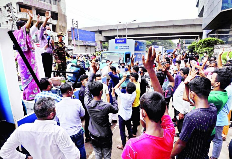 DNCC Mayor Atiqul Islam speaks at the mass awareness rally in the city's Uttara 4 No Sector with a view to resisting dengue and chikunguniya diseases.