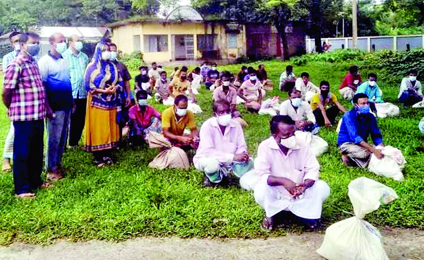 Kuliarchar UNO Rubaiyat Ferdousi distributes food aid provided by the Prime Minister Sheikh Hasina as gifts for survival of 90 jobless motor vehicle workers in the area amid nationwide lockdown in a formal event held at Kuliarchar Upazila Parishad premise