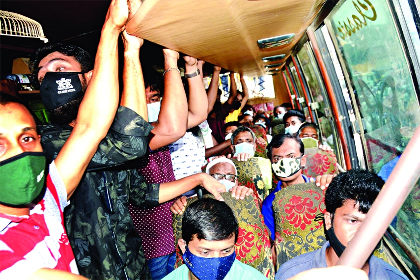 Passengers overcrowd a bus beyond its capacity in the capital on Wednesday after the resumption of public transports.