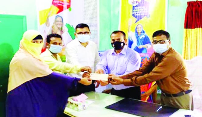 Upazila Executive Officer Saifur Rahman as chief guest and Mohammad Kamruzzaman Sarkar, Deputy Director, BRDB, Bhola District as special guest distribute loan cheques among 18 rural entrepreneurs of BRDB in Borhanuddin, Bhola on Thursday.