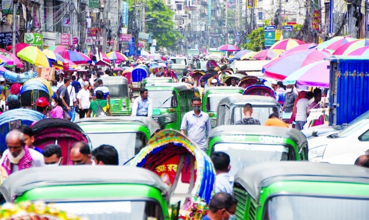 Most of city roads have lost width following the return of street vendors with their makeshift shops as lockdown goes. This photo was taken from city busy street in Mirpur on Thursday.