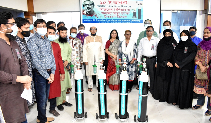 Md. Abul Hossain, Managing Director of Investment Corporation of Bangladesh (ICB), poses for a photo after handing over Oxygen cylinder among various organizatios at its head office on Friday marking the National Mouring Day-2021. Senior officials of the