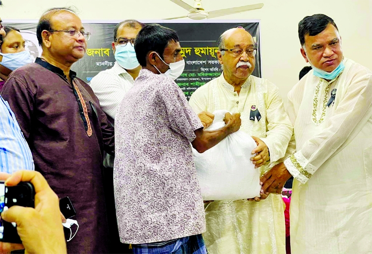 Industries Minister Nurul Mazid Mahmud Humayun distributes foodstuff among the distressed people in Belabo Upazila Parishad auditorium in Narsingdi on Saturday marking the 46th martyrdom anniversary of Father of the Nation Bangabandhu Sheikh Mujibur Rahma