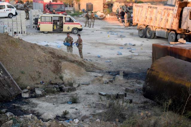 Lebanese soldiers investigate next to fuel tankers that were exploded, in Tleil village, north Lebanon, Sunday, Aug. 15, 2021.