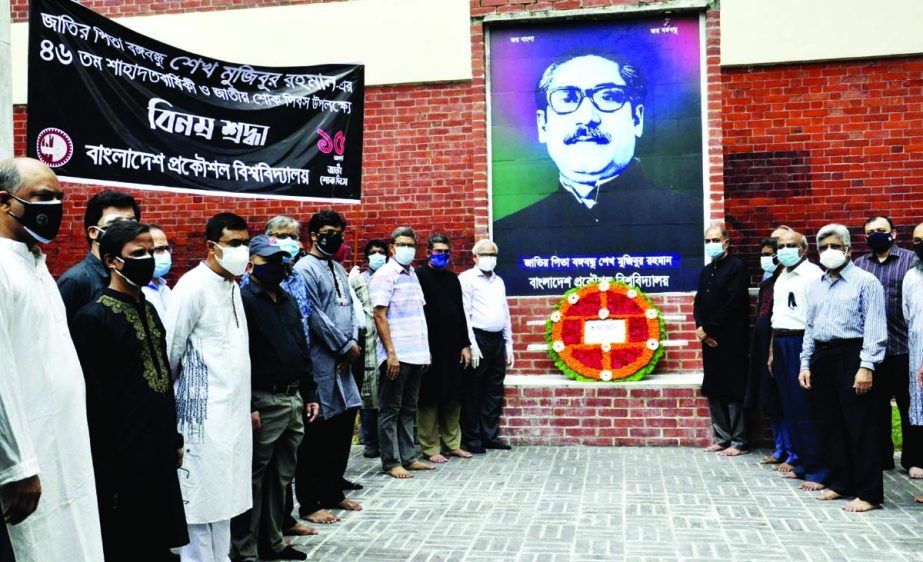 Teachers and employees of BUET place floral wreaths on the portrait of Bangbandhu on its campus on Sunday marking National Mourning Day.