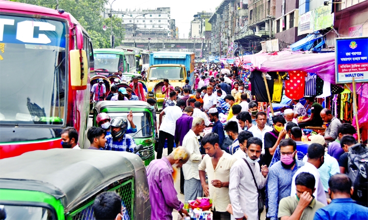 Life comes down to normal: People swarm at Gulistan area in the capital on Monday as though they are totally Covid free.