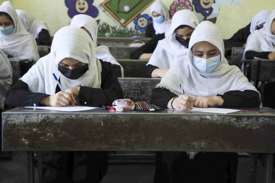 Schoolgirls attend class in Heart, Afghanistan on Tuesday. Agency photo