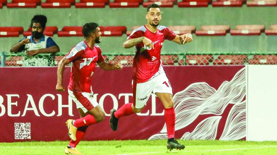 Bashundhra Kings' Brazilian recruit Robson (right) celebrates after scoring a goal against Maziya Sports & Recreation Club of Maldives in their Group-D match of the AFC Cup at the at National Football Stadium in the Maldives on Wednesday night. Agency p