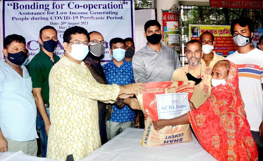 Professor Dr Mohiuddin Ahmed of IBA, Dhaka University distributes food items among the destitute people at a function under the aegis of ACBA Forum, Institute of Business Administration at Palashi Bazar area in the capital on Friday.