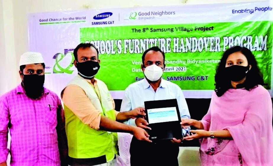 Project Manager of Good Neighbors Bangladesh Md Arif Hissain Hands over School Furniture to Dhaka's Pallabi Thana Education Offer Frazana Sharmin at a function on Wednesday (Aug18). NN photo