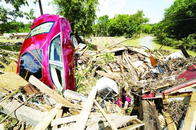 A car is among debris that washed up against a bridge in Waverly, Tennessee.