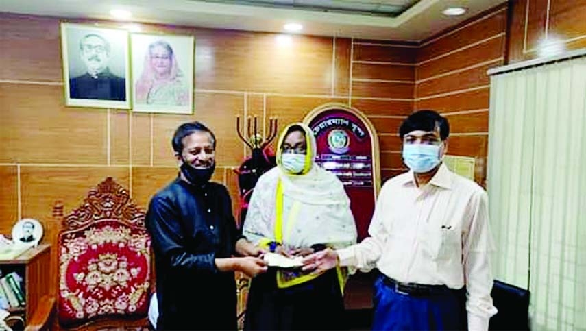 Feni Zila Parishad Chairman Khairul Bashar Majumder and its Chief Executive Officer Abu Daud Mohammad Golam Mostofa hand over a cheuqe from the Zila Parishad Fund to help Gol Nahar, Secretary, Fulgazi Upazila Mohila Awami League for her treatment in a for