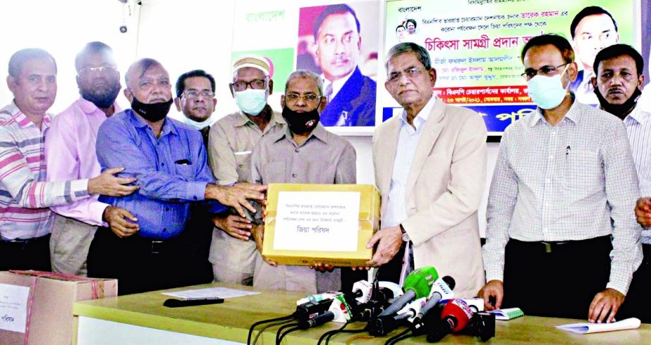 BNP Secretary General Mirza Fakhrul Islam Alamgir distributes medical equipments for Covid-19 Help Center at a function organised by Zia Parishad at the office of BNP chairperson in the city's Gulshan on Monday.