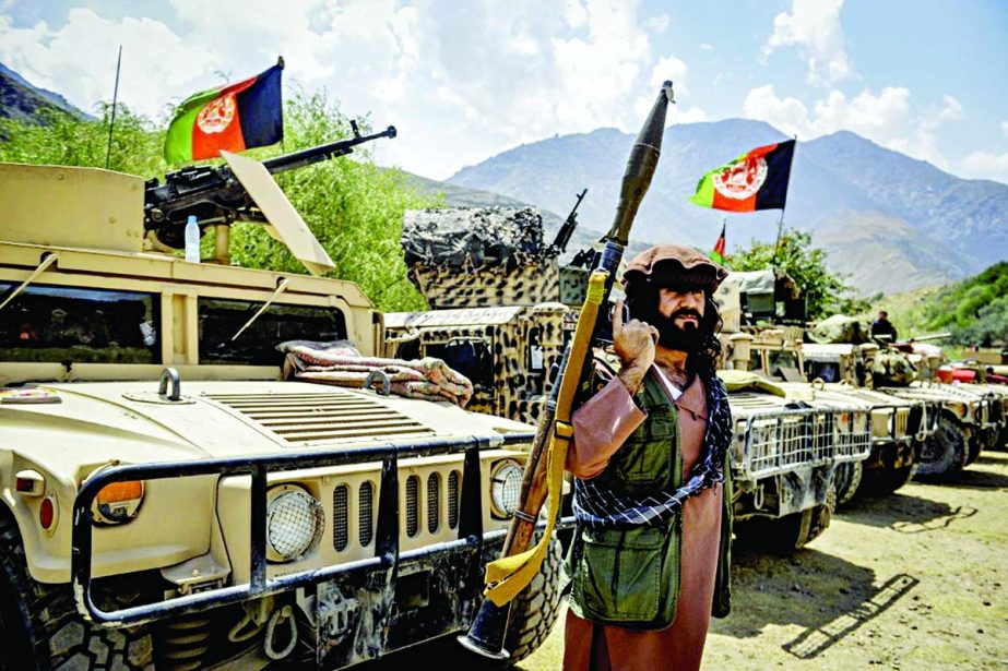 Afghan armed men supporting the Afghan security forces against the Taliban stand with their weapons and Humvee vehicles at Parakh area in Bazarak, Panjshir province. Agency photo