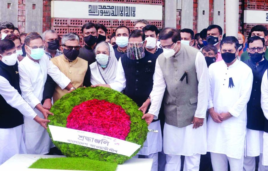 General Secretary of AL and Road Transport and Bridges Minister Obaidul Quader along with party colleagues pays floral tributes at the grave of Ivy Rahman in the city's Banani Graveyard on Tuesday marking the latter's 17th death anniversary. NN photo