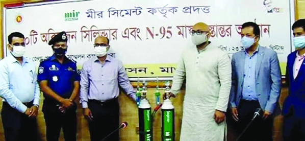 Managing Director of Mir cement Naba-E-Jahir in a formal ceremony at Magura DC office on Monday hands over 70 oxygen cylinders, 1000 N-95 masks to the authority of Magura 250-bed Hospital in presence of Magura Deputy Commissioner Dr. Ashraful Alam. Among