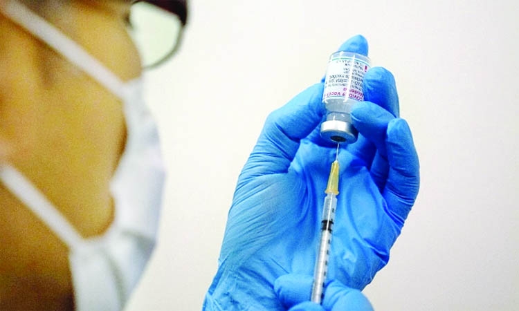 Medical staff prepares Moderna's vaccine vaccine to be administered at a mass vaccination centre in Tokyo, Japan.