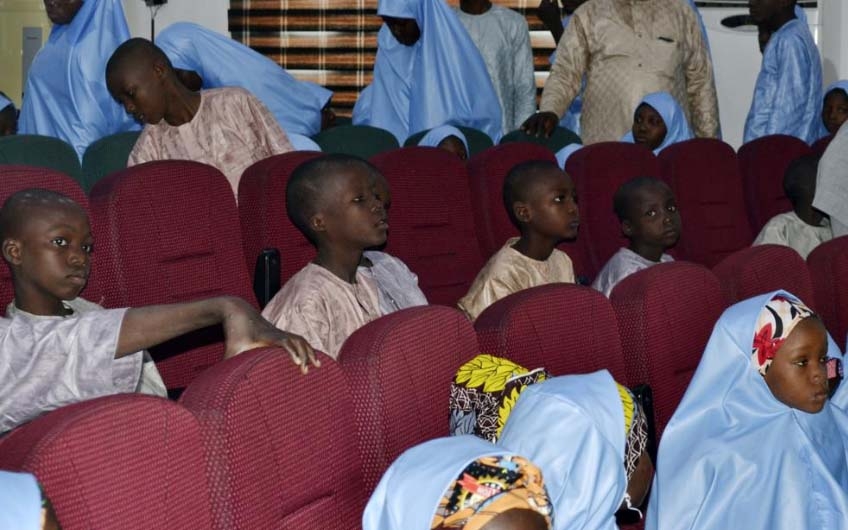 Some freed students from the Salihu Tanko Islamic School are reunited with their parents in Minna, Nigeria, Friday, Aug. 27, 2021. A school official in northern Nigeria says gunmen have released some of the more than 100 children who had been abducted bac