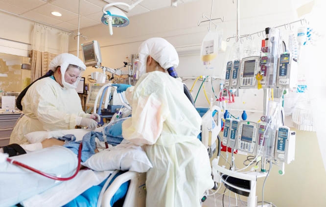 Healthcare personnel work in a Covid-19 intensive care unit where they are dealing with a surge in cases of the Delta variant at Intermountain Medical Center in Murray, Utah, US.