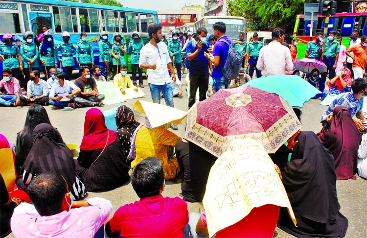 Students of seven colleges under Dhaka University stage protest demanding re-evaluation of their exam results on a city street on Sunday.