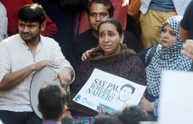 Fatima Nafees, holding placard, with ex-JNU student leader Kanhaiya Kumar, left, and others during a protest march in New Delhi