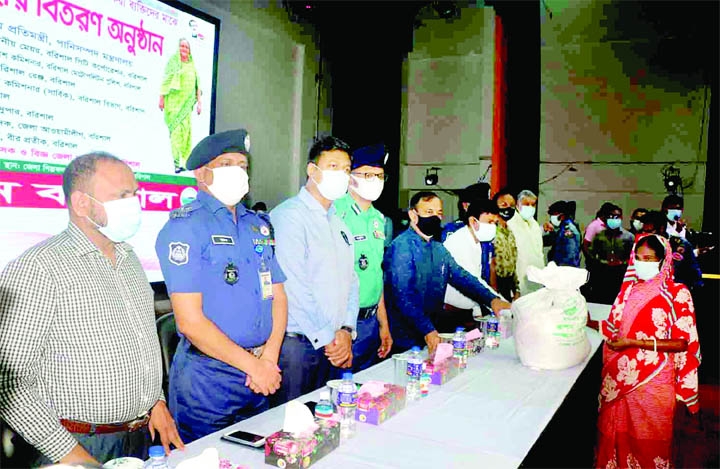 State Minister for water resources Zahid Faruk, MP distributes relief goods among distressed people in a formal ceremony at Barishal Shilpakala Academy on Monday assuring that corona preventive vaccine would be provided to all.