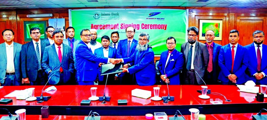 JQM Habubullah, DMD of Islami Bank Bangladesh Limited (IBBL) and Md. Shafiqul Islam, General Manager (Sales & Marketing) of US Bangla Airlines Limited, exchanging document after signing a MoU at IBBL head office in the capital on Tuesday. Under the deal,