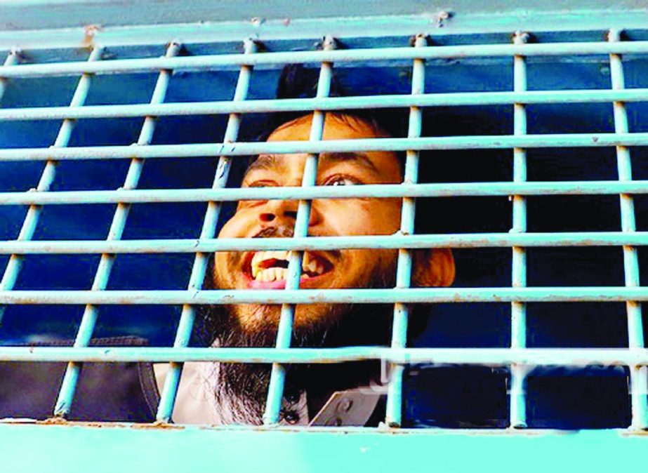 One of the convicts in the murder case of LGBT rights activist Xulhaz Mannan and his friend Mahbub Rabbi Tonoy is seen laughing inside a prison van while he is taken back to jail after the death sentence verdict was delivered on Tuesday,