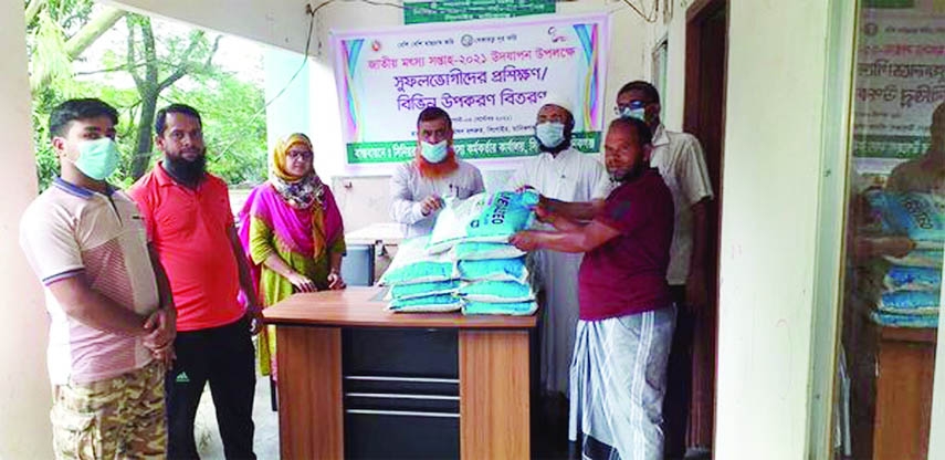 Manikganj District Fisheries Officer Md. Saifur Rahman as chief guest distributes zeolite among 10 farmers of Singair upazila free of cost on Thursday while Singair Senior Upazila Fisheries Officer Wahidul Abrar, Extension Officer Tahera Rahmania, Fisheri