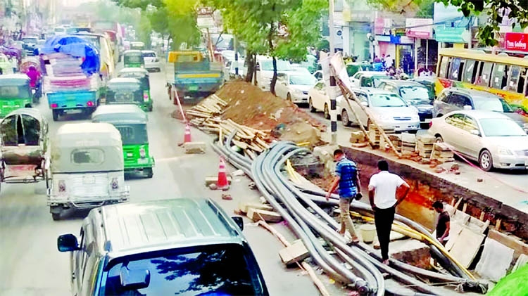 A huge traffic congestion created on both sides of the road for diversion due to digging at its middle Badda area in the capital on Thursday.