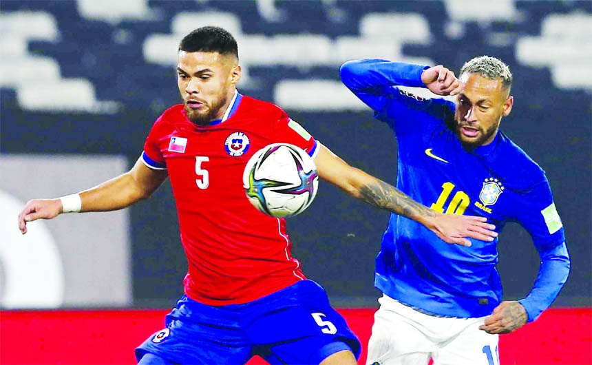 Brazil's Neymar (right) and Chile's Paulo Diaz battle for the ball during a qualifying soccer match for the FIFA World Cup Qatar 2022 at Monumental Stadium in Santiago, Chile on Thursday.