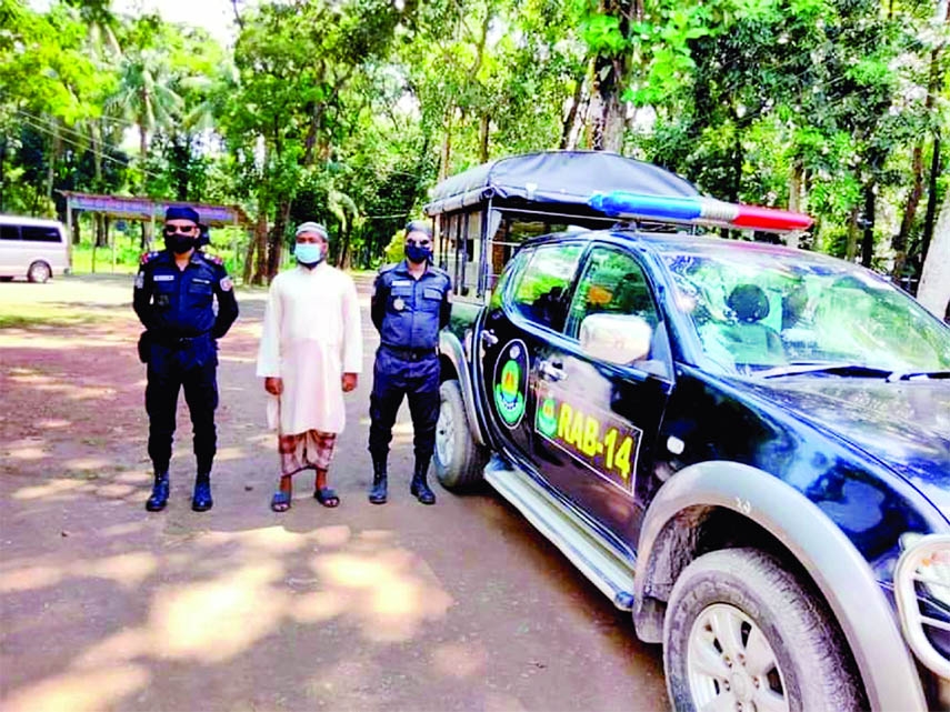 Members of RAB-14 arrest a madrasa teacher Maulona Belal Hossain Billal (35) from Gouripur in Mymensingh Friday for rapping a nine years old student in Kishoreganj.