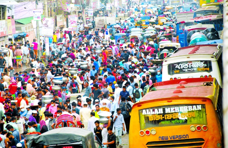 Customers throng the Jatrabari Kutchabazar area in the capital on Friday defying health norms and hampering vehicular movement.