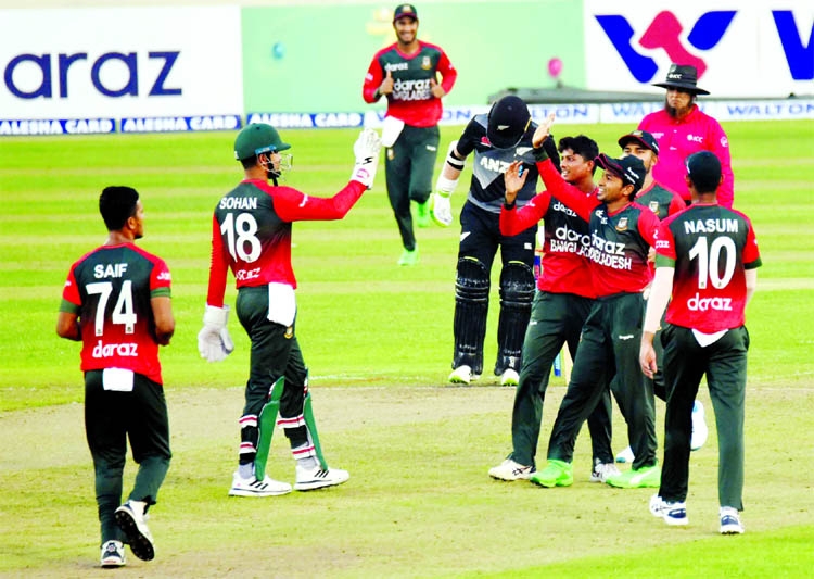 Wicketkeeper Nurul Hasan Sohan (2nd from left) of Bangladesh celebrating with his teammates after dismissal of a New Zealand batsman during their second Twenty20 International match at the Sher-e-Bangla National Cricket Stadium in the city's Mirpur on F