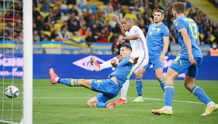 France forward Anthony Martial (2nd left) shoots to score his team's opening goal against Ukraine during their 2022 FIFA World Cup qualifying match at the Olympic Stadium in Kiev on Saturday.
