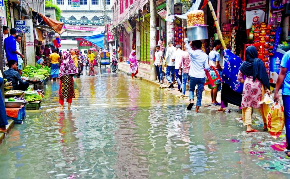 A road in the capital's Bhatara area gets flooded with sewerage water due to poor drainage system. Residents of the area suffer as a result. NN photo