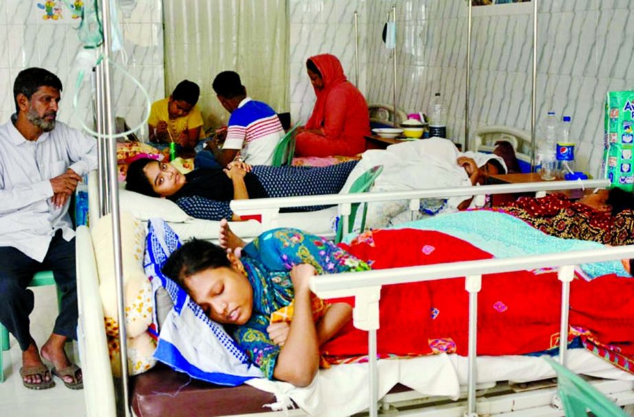 Two girls infected with dengue fever being treated at the Holy Family Hospital in the capital on Sunday. NN photo