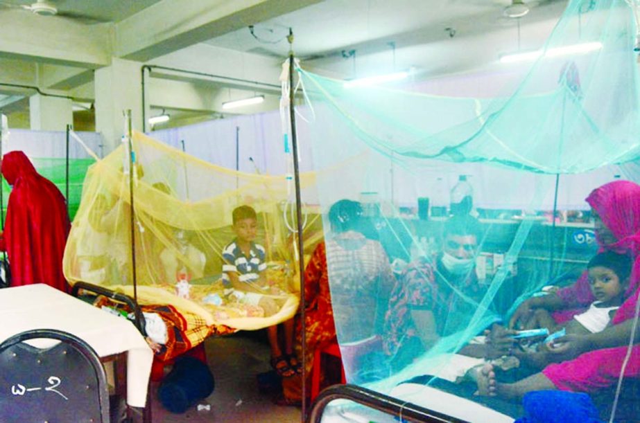 Dengue patients, protected under mosquito curtains, receive treatment at the Dhaka Shishu Hospital on Tuesday. NN photo