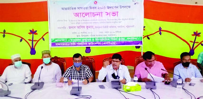 Patuakhali Golachipa UNO Ashish Kumar speaks at discussion meeting to mark the International Literacy Day on Wednesday.