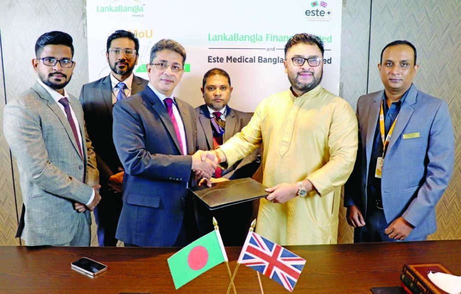 Md. Minhaz Uddin, Head of Cards of LankaBangla Finance Limited (LBFL) and Mohammed Faisal, Managing Director of Este Medical Bangladesh, exchanging document after signing a MoU for their respective organizations recently. Under the deal, card member of LB