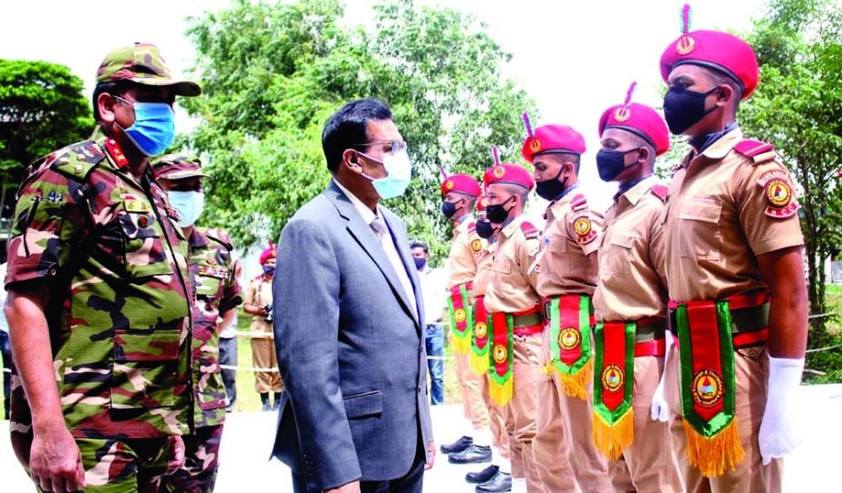 Secretary of the Ministry of Liberation War Affairs Khwaja Mia visits the guard at a function by BNCC cadets held at BNCC Training Academy in Savar on the outskirt of Dhaka on Sunday. ISPR photo