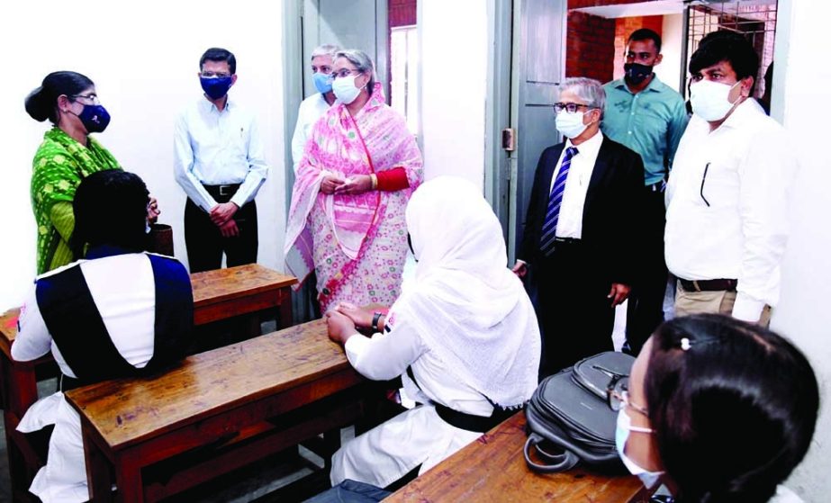 Education Minister Dr Dipu Moni visits Udayan Uchcha Madhyamik Bidyalaya in the capital on Sunday on the first day of reopening all educational institutions after 18-month closure due to coronavirus. Dhaka University Vice -Chancellor Prof Dr Md. Akhtaruzz