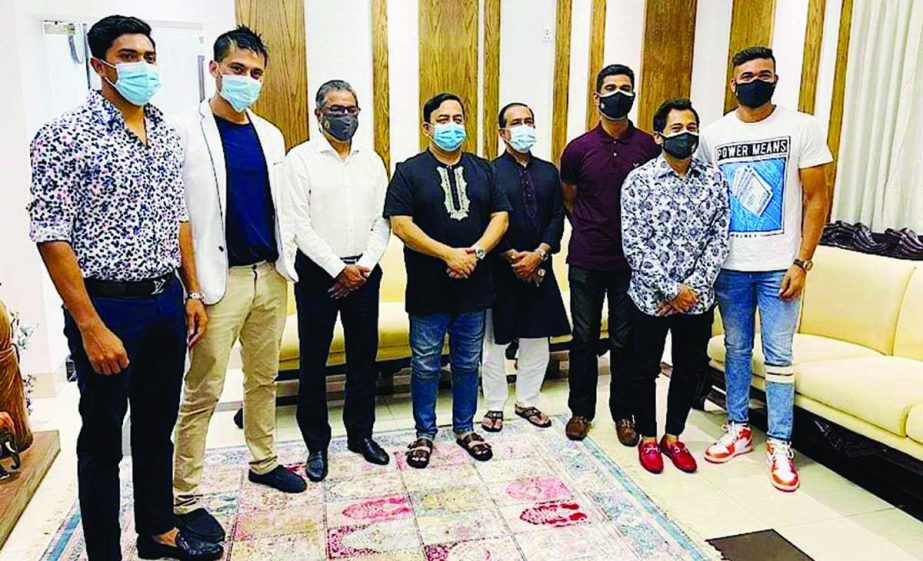 Players and officials of Dhaka Mohammedan Sporting Club Limited pose for a photo session after signing the agreement at the city residence of Dr Benazir Ahmed, Chairman of the Development Committee of Dhaka Mohammedan Sporting Club Limited and I