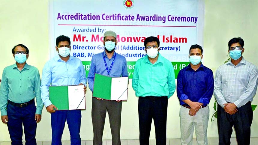 Md Monwarul Islam, Director General of Bangladesh Accreditation Board (BAB), poses for photo session at certificate handed over ceremony to officials of Summit Power Limited, the first IPP in Bangladesh to receive testing and calibration accreditations fo